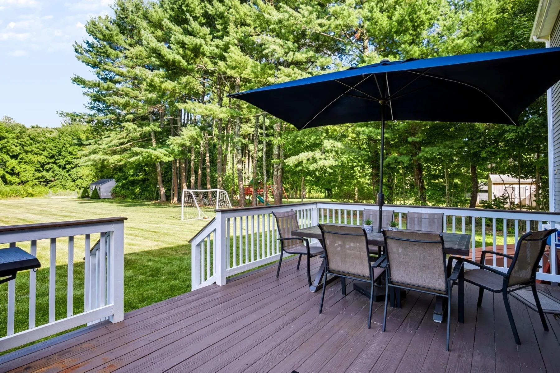 Deck with seating and a view of the yard