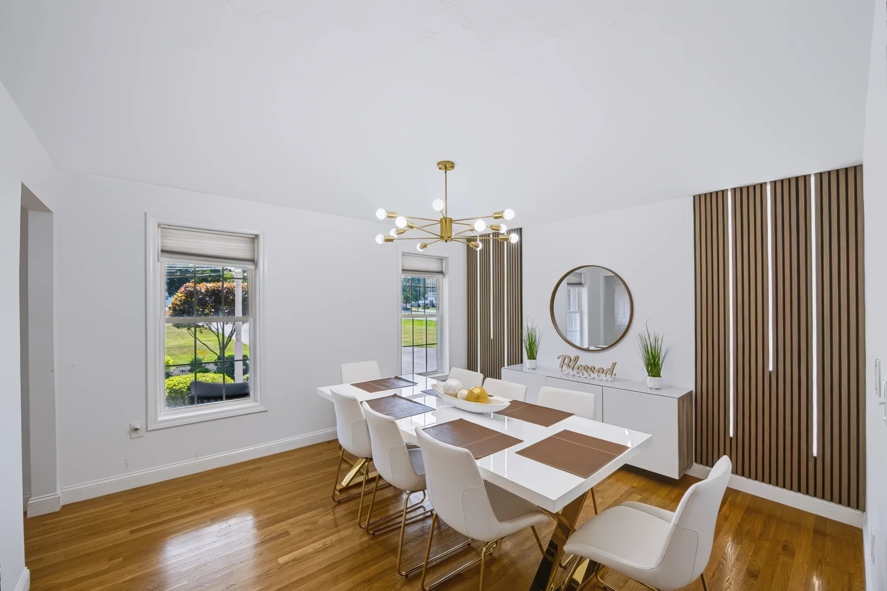 Dining area with table, window and hardwood flooring