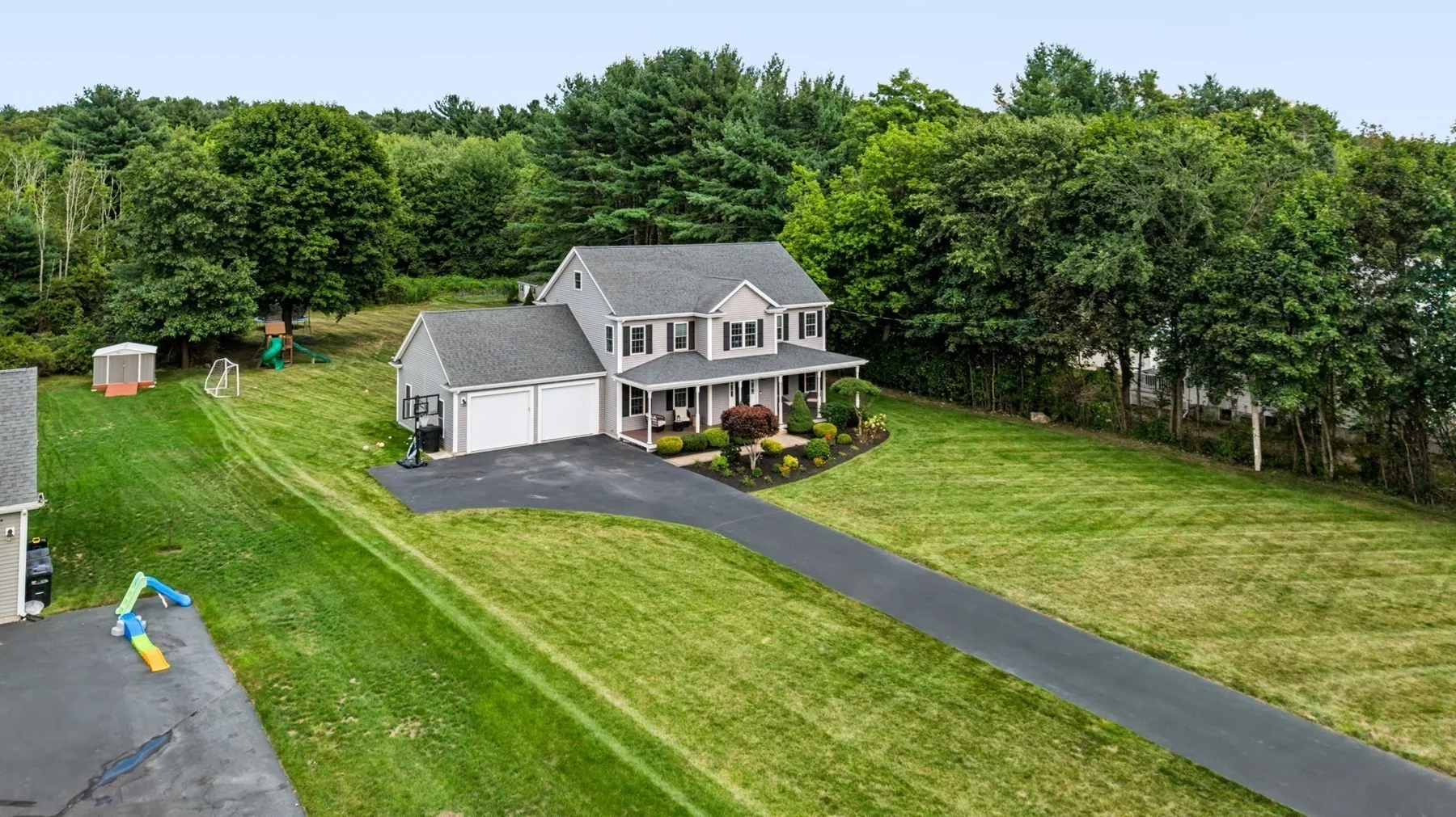 The home, long driveway and surrounding grounds