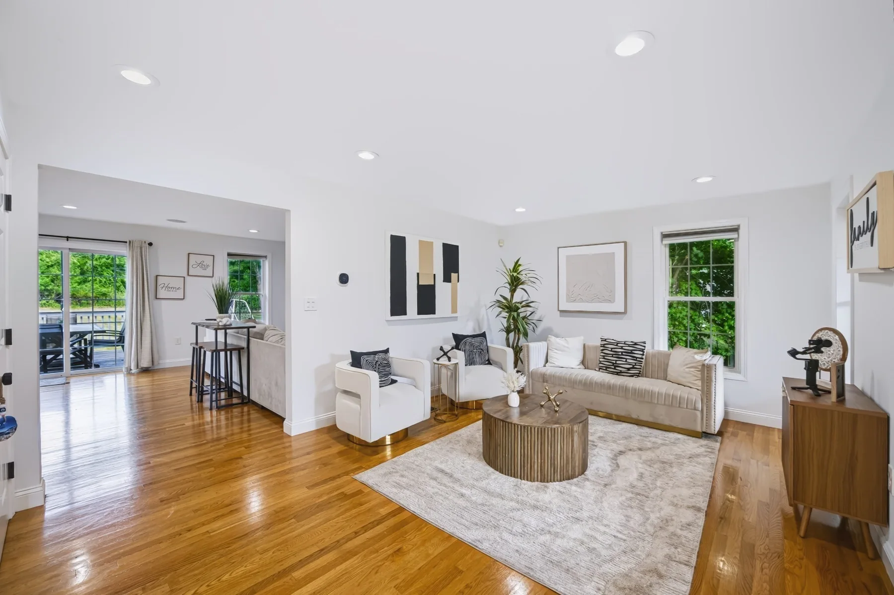 Bright living room with windows and hardwood flooring