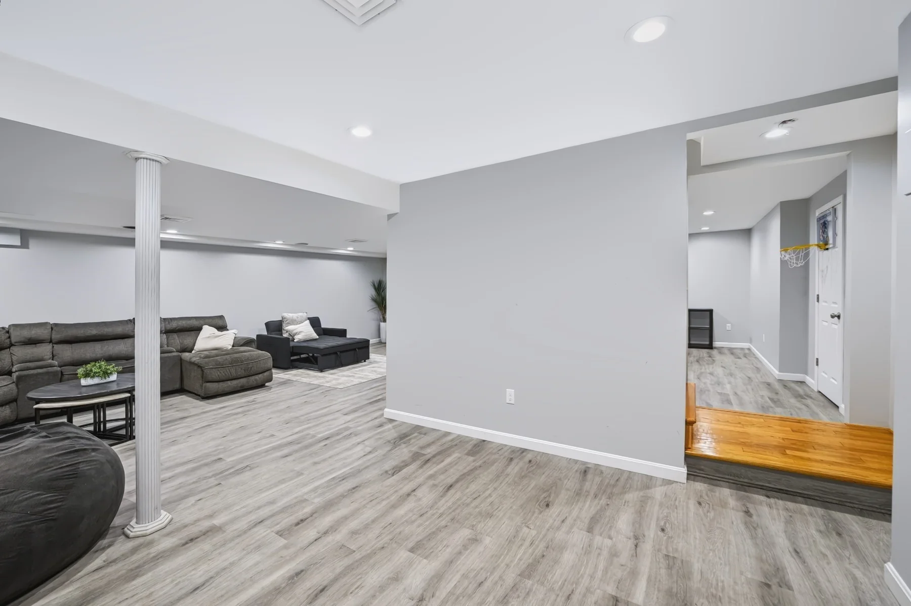 Finished lower level with light flooring and open space